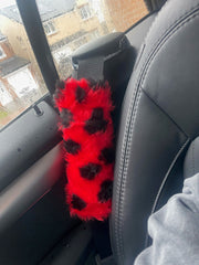 ladybird spotty fuzzy car seatbelt pads red and black 1 pair