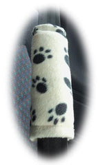 1 pair of fleece paw print car seatbelt pads white and black and multicolour White with black paw prints