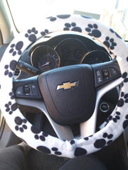 Paw print fleece car steering wheel cover in black and white and multi-coloured